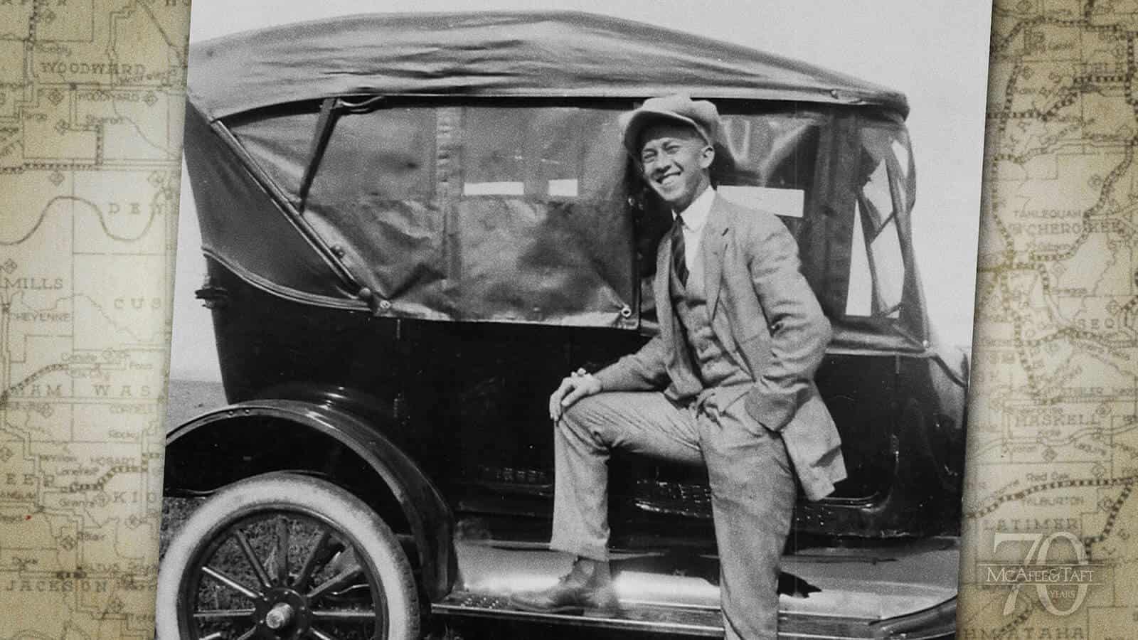 Photo of a young Kenneth McAfee with his Model T Ford